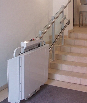 Savaria Delta Inclined Platform Lift attached to an indoor staircase
