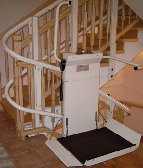 Savaria Omega Inclined Platform Lift attached to U-shaped stairs in a home