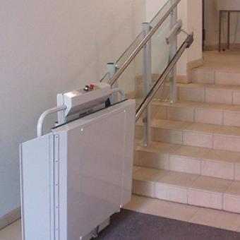 Savaria Delta Inclined Platform Lift attached to an indoor staircase